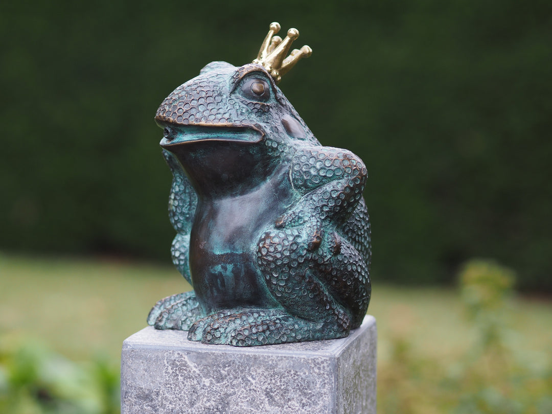 Bronze sculpture and fountain of a seated frog wearing a crown