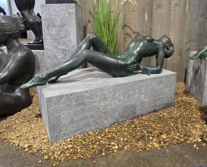 Large bronze sculpture of a reclining sensual female nude