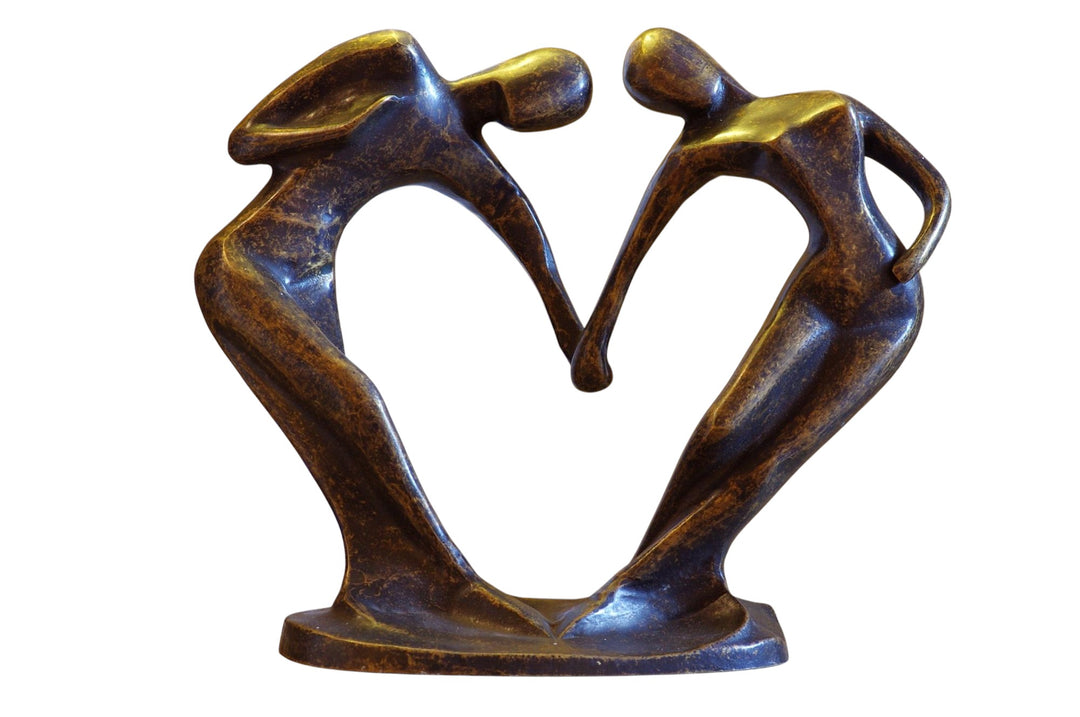 Modern bronze sculpture of a couple forming a heart