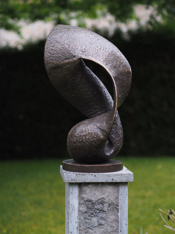 Modern bronze sculpture of a wave in motion