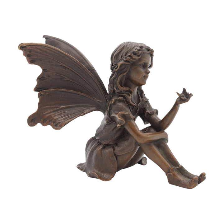 Bronze sculpture of a sitting little fairy with a butterfly