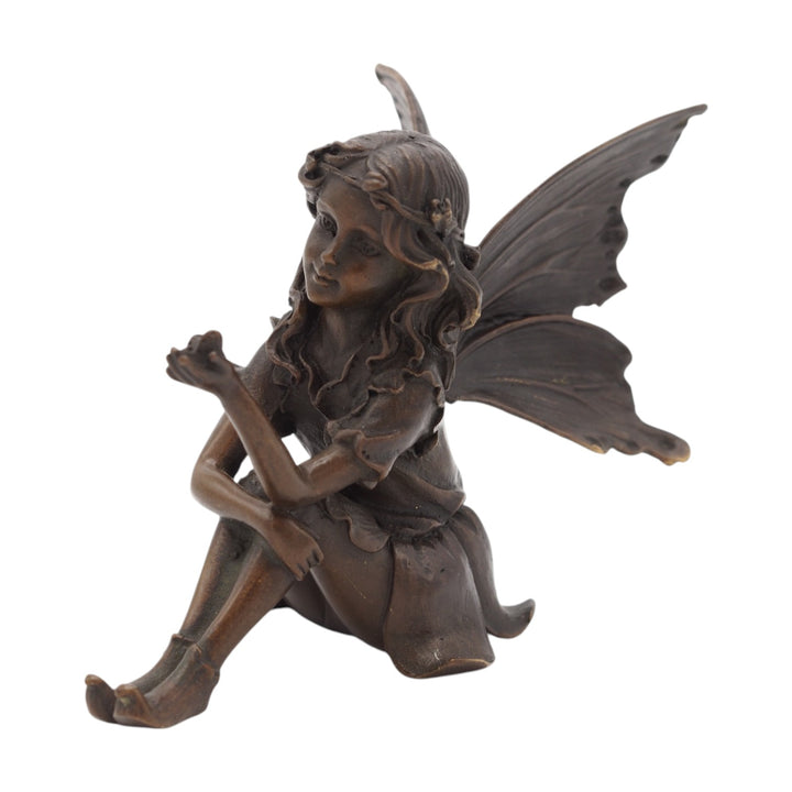 Bronze sculpture of a sitting little fairy with a butterfly