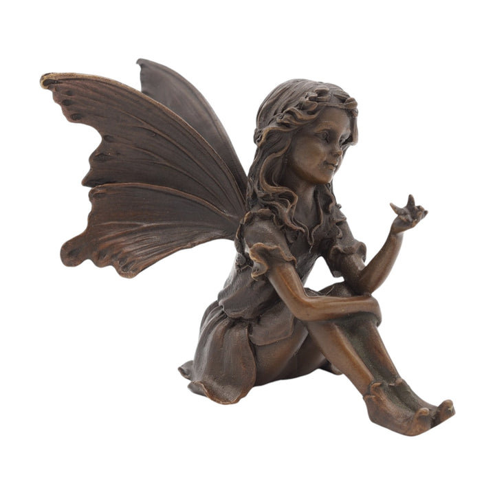 Bronze sculpture of a sitting little fairy with a butterfly