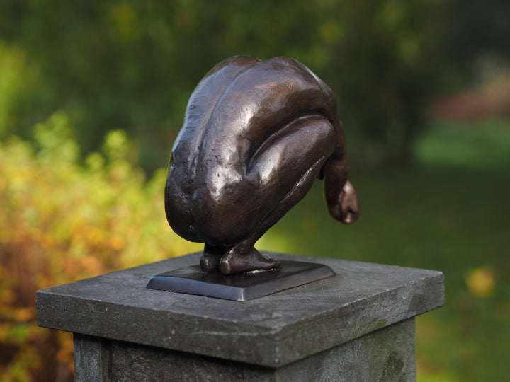 Bronze sculpture of a crouching man in a moment of balance (medium)