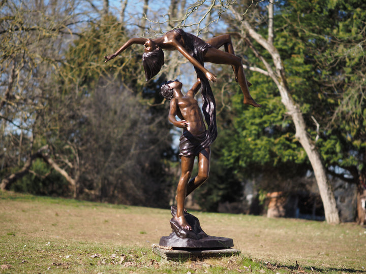 Lifesize bronze sculpture of a couple dancing gracefully
