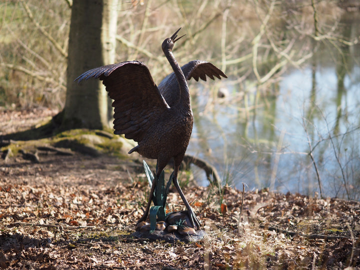 Graceful bronze stork fountain and sculpture