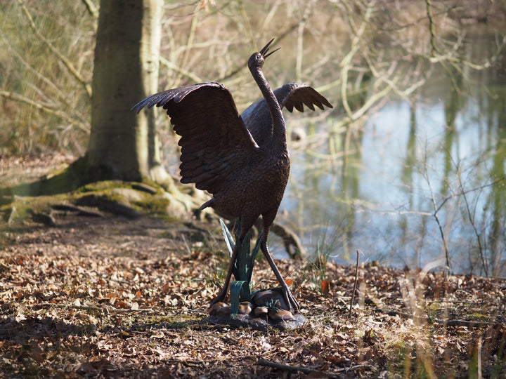 Graceful bronze stork fountain and sculpture
