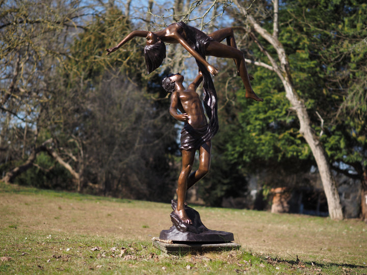 Lifesize bronze sculpture of a couple dancing gracefully