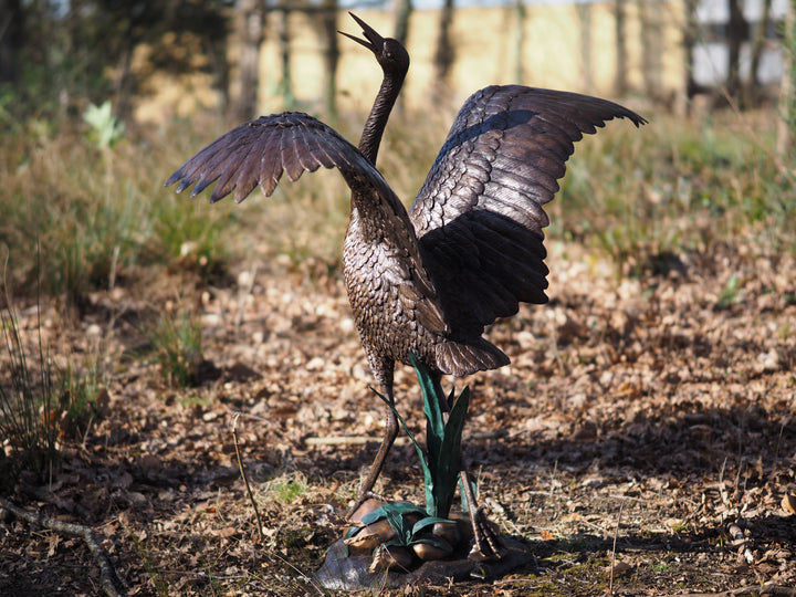 Graceful bronze stork fountain and sculpture
