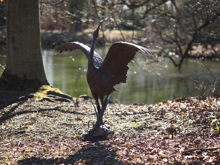 Graceful bronze stork fountain and sculpture