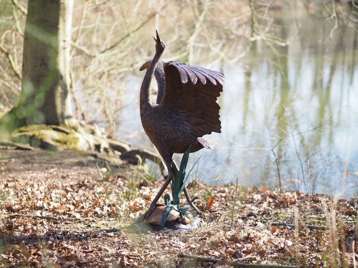 Graceful bronze stork fountain and sculpture
