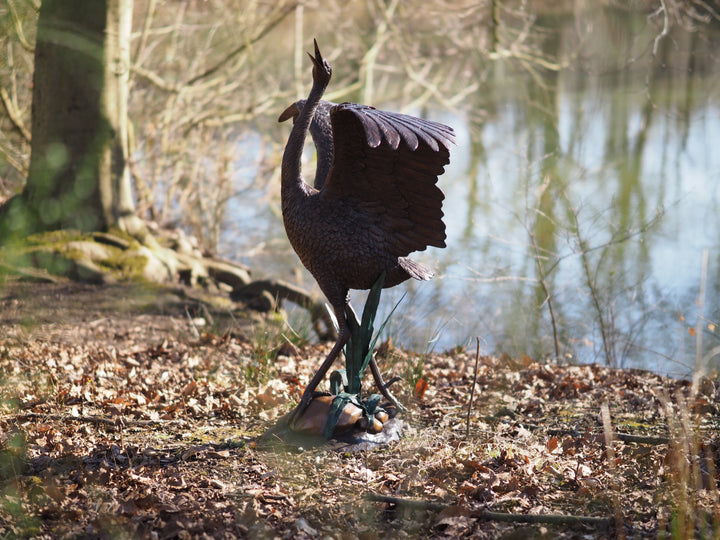 Graceful bronze stork fountain and sculpture