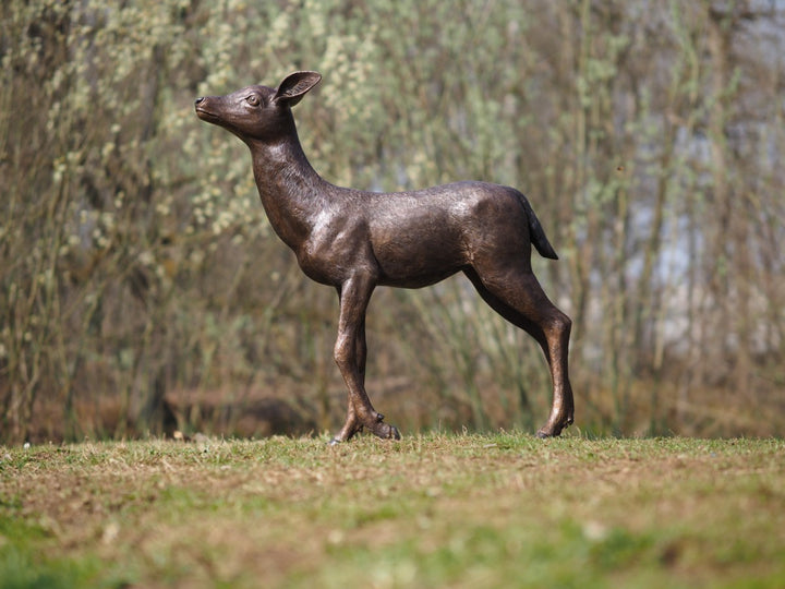 Large bronze sculpture of a deer calf