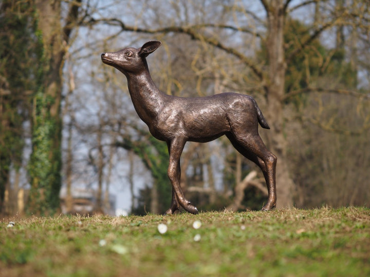 Large bronze sculpture of a deer calf
