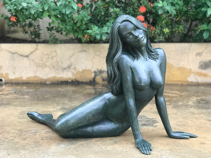 Large bronze sculpture of a reclining nude woman