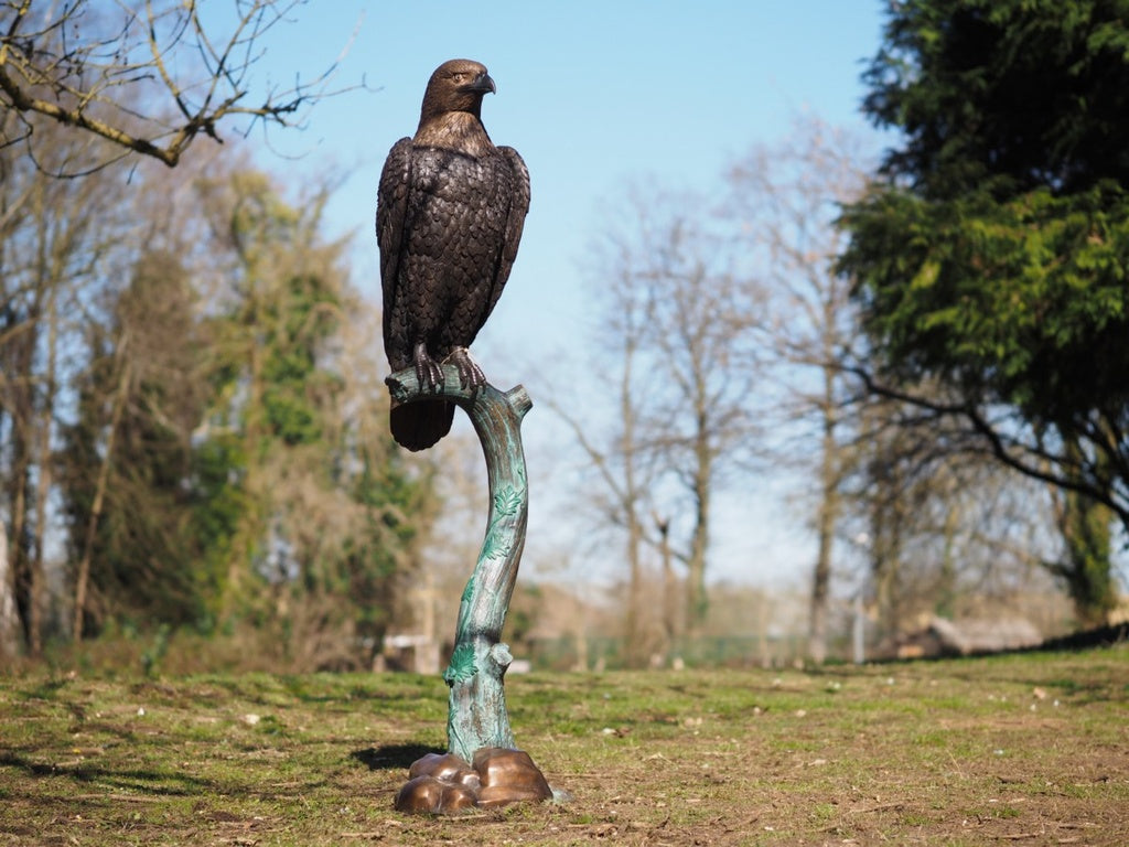 Lifesize bronze sculpture of an eagle on a branch