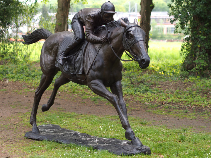 Lifesize bronze sculpture of a jockey on racehorse at full speed