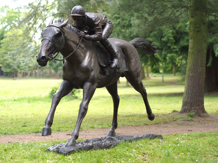 Lifesize bronze sculpture of a jockey on racehorse at full speed