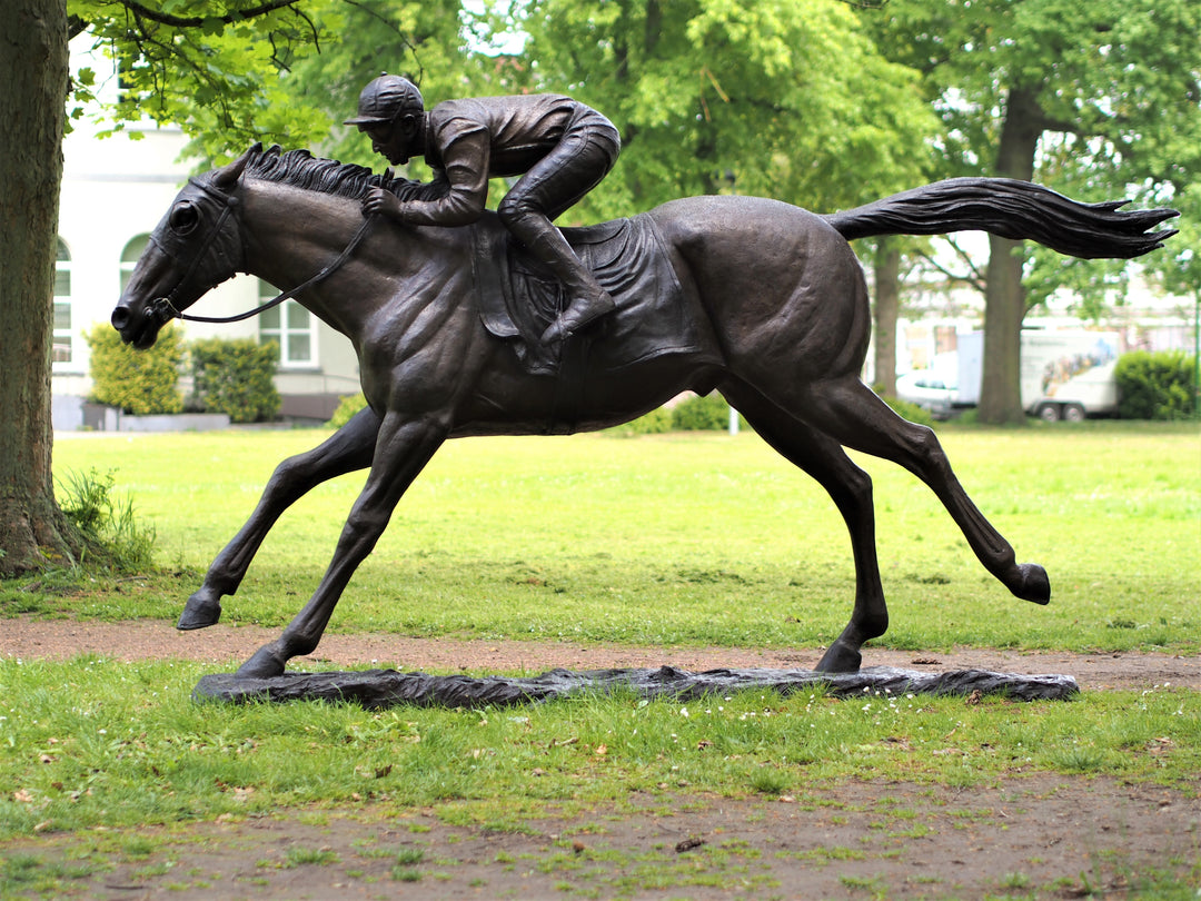 Lifesize bronze sculpture of a jockey on racehorse at full speed