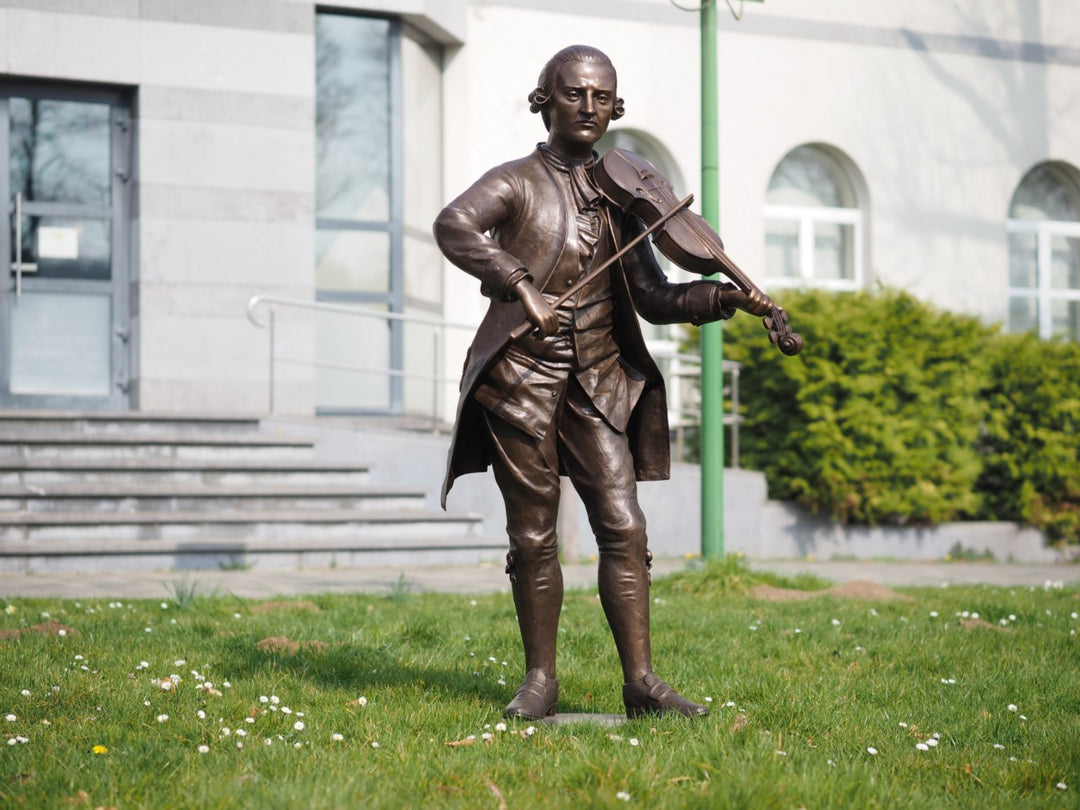 Lifesize bronze sculpture of Mozart playing the violin