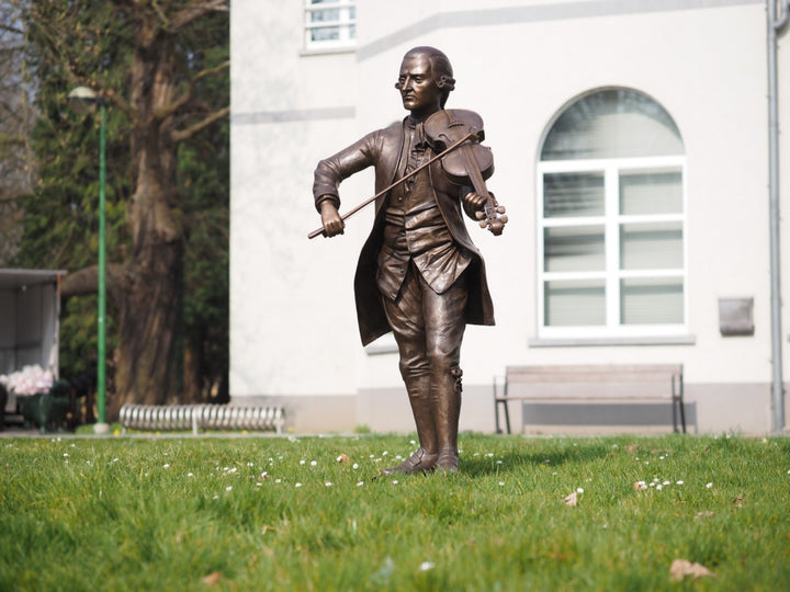 Lifesize bronze sculpture of Mozart playing the violin