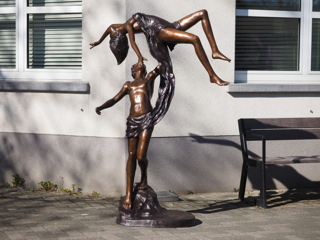 Lifesize bronze sculpture of a couple dancing gracefully
