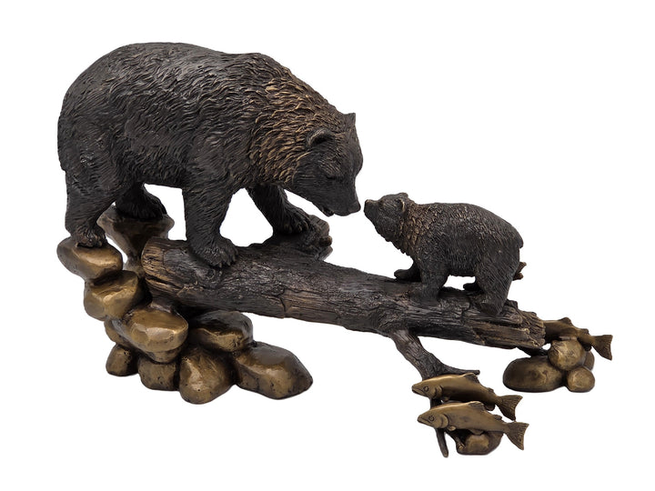 Bronze sculpture of a bear with cub on tree trunk