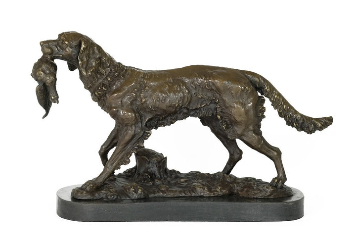 Bronze sculpture of a hunting dog with prey