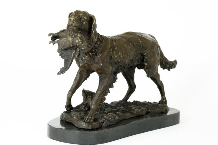 Bronze sculpture of a hunting dog with prey