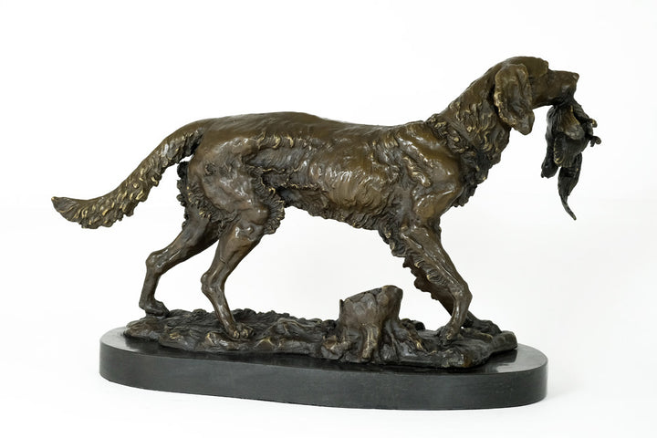 Bronze sculpture of a hunting dog with prey