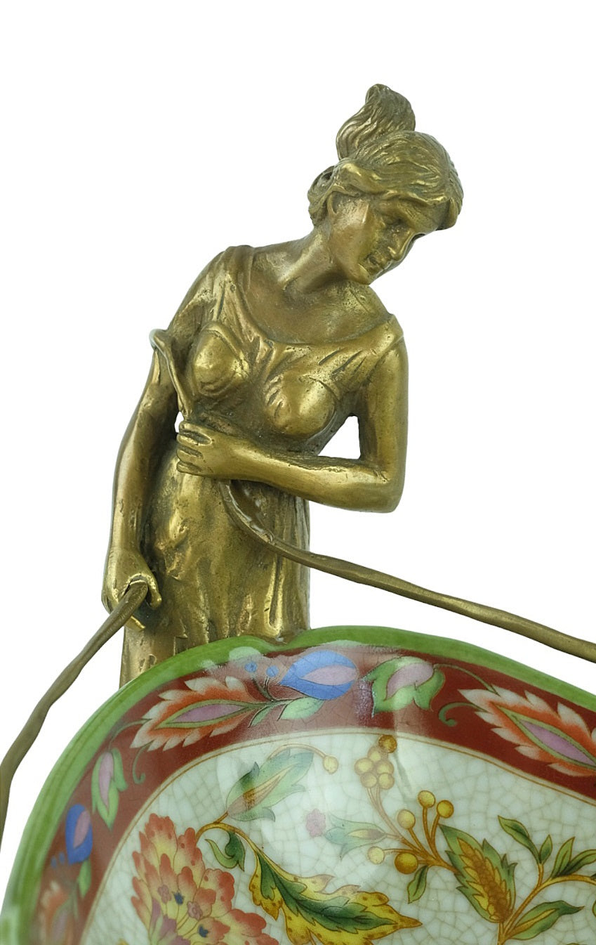 Porcelain tray with floral motifs carried by two bronze females