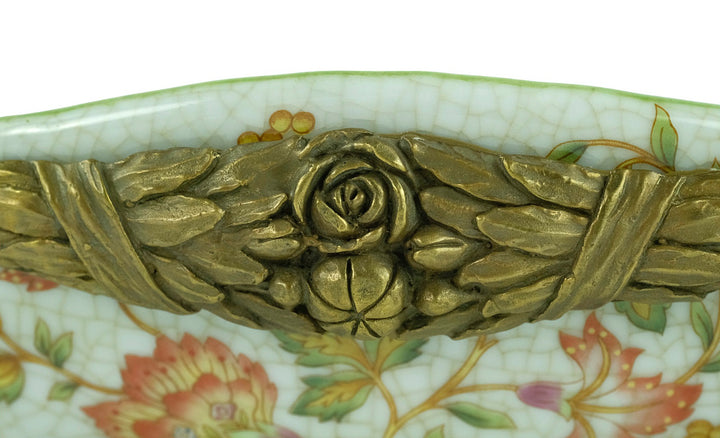 Porcelain tray with floral motifs carried by two bronze females
