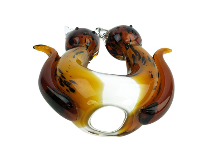 Glass sculpture of a cat pair