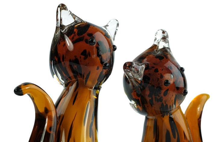 Glass sculpture of a cat pair