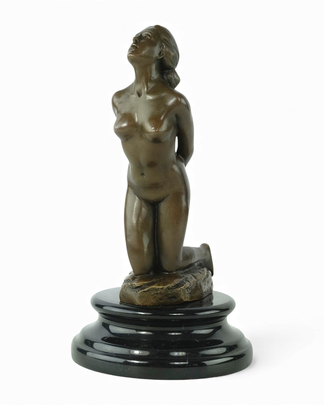 Bronze sculpture of a submissive kneeling female nude
