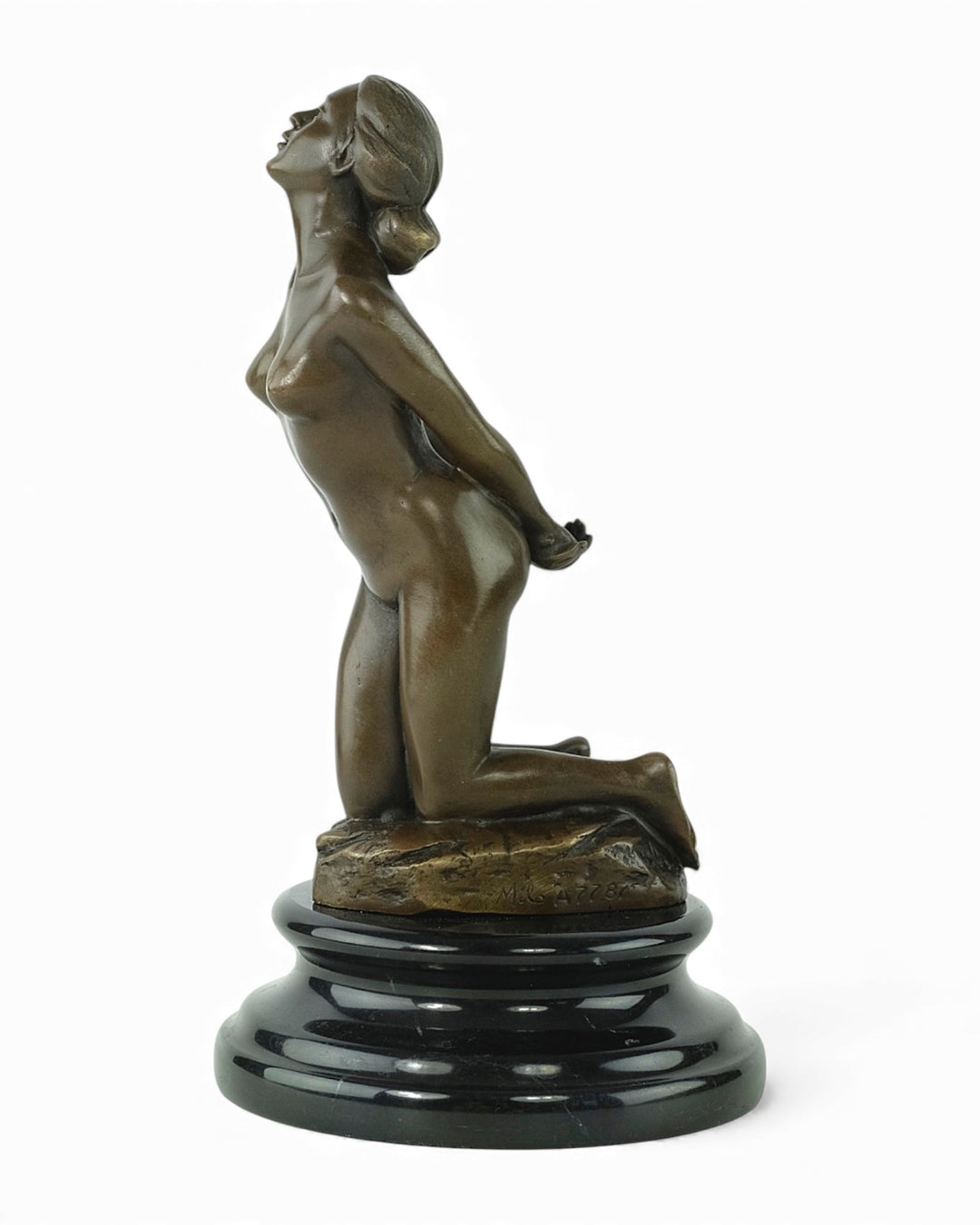 Bronze sculpture of a submissive kneeling female nude