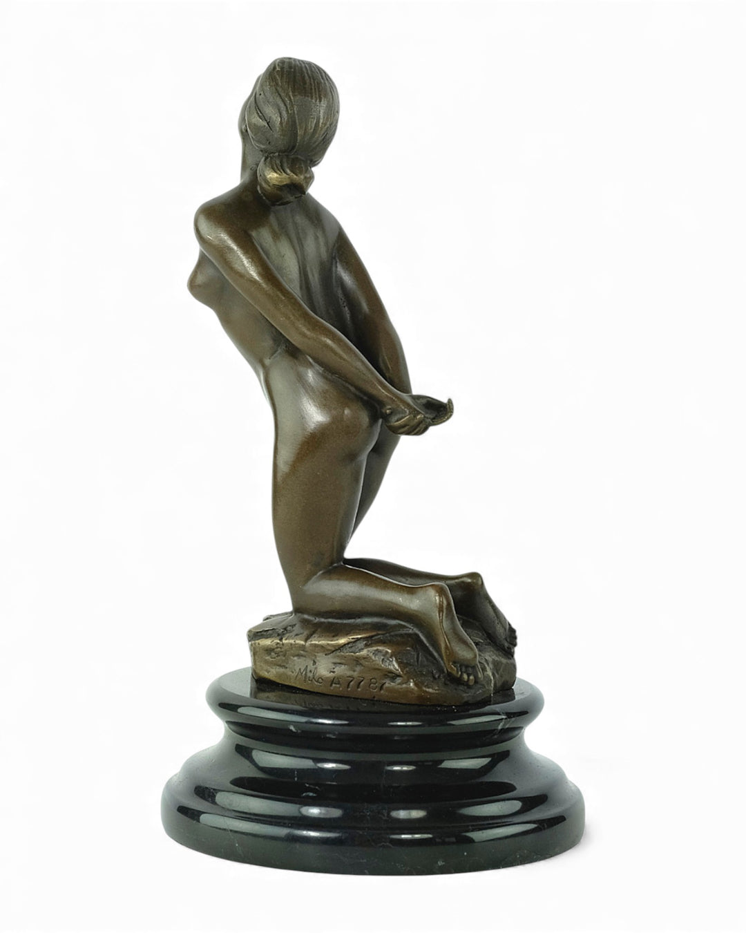Bronze sculpture of a submissive kneeling female nude