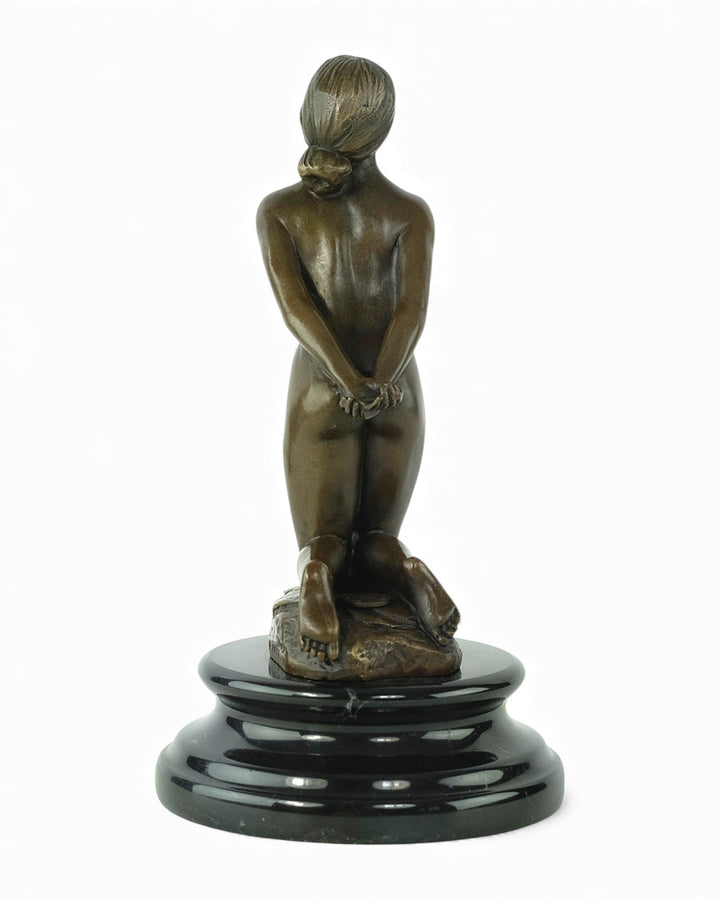 Bronze sculpture of a submissive kneeling female nude