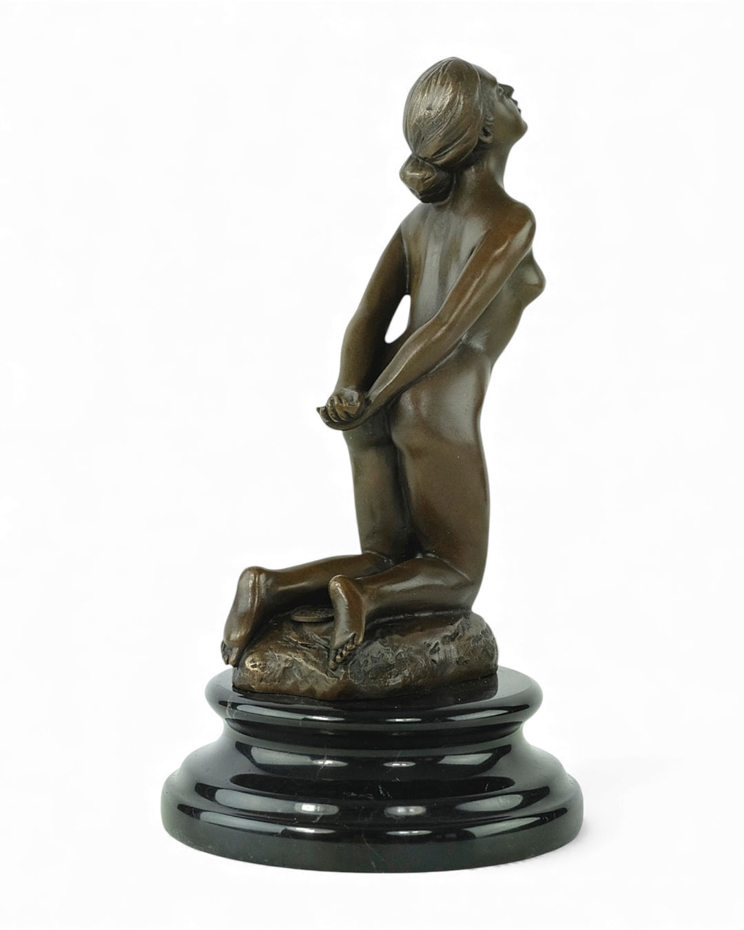 Bronze sculpture of a submissive kneeling female nude