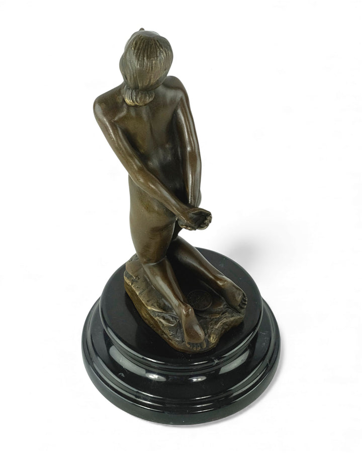 Bronze sculpture of a submissive kneeling female nude