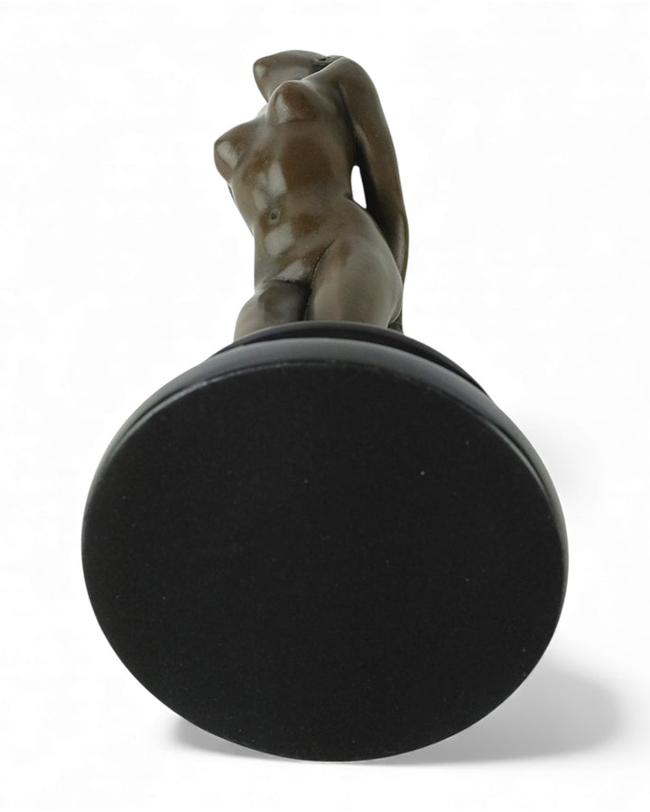 Bronze sculpture of a submissive kneeling female nude