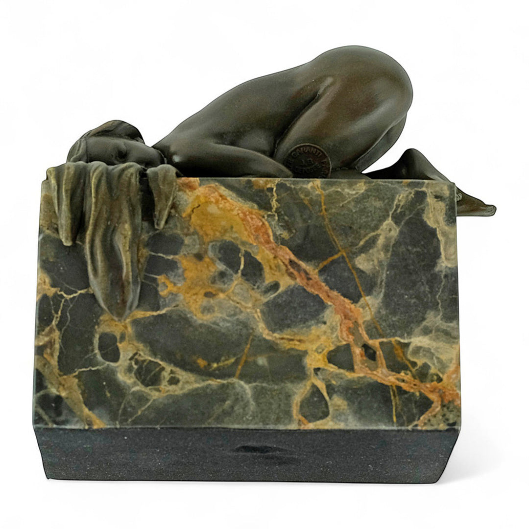 Bronze sculpture of a sensual resting female