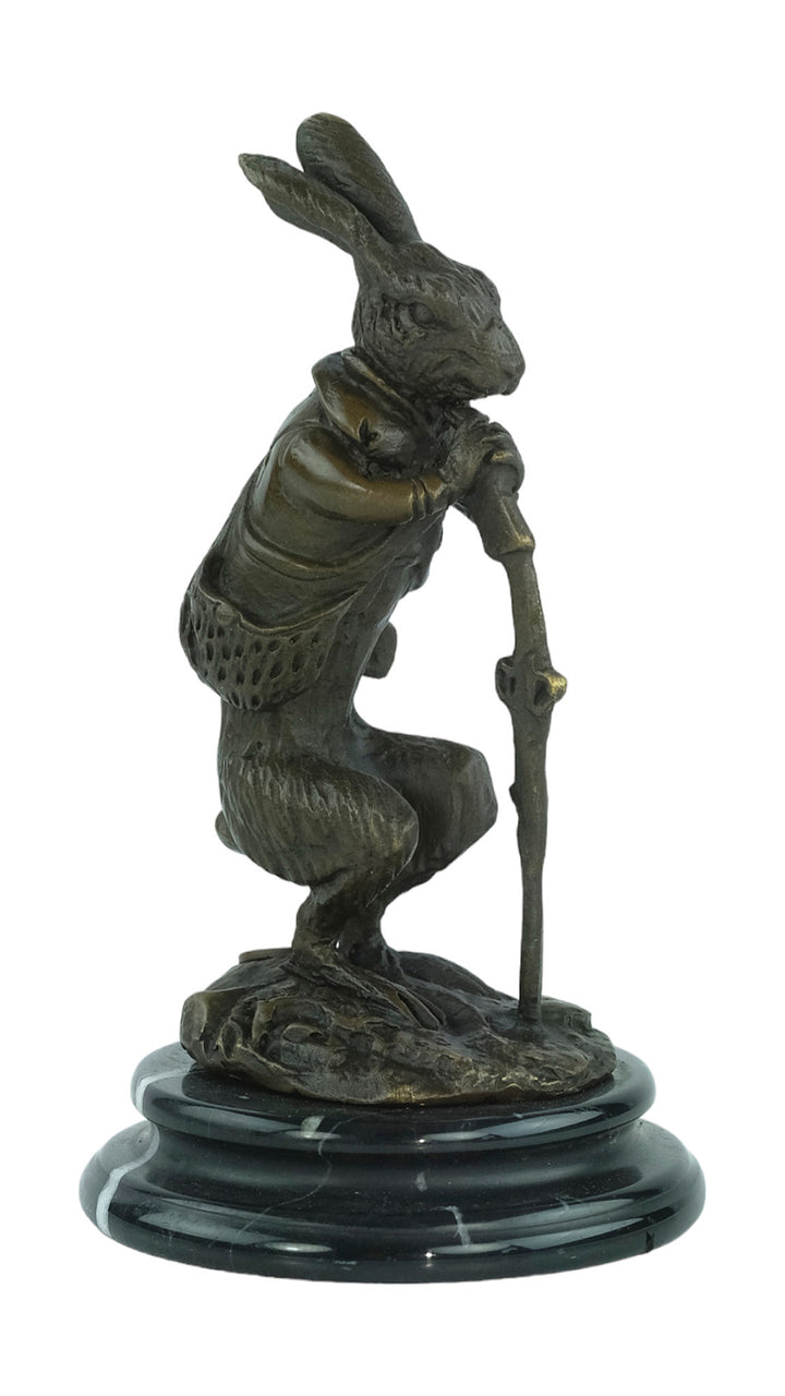 Bronze sculpture of a hare dressed as a hunter