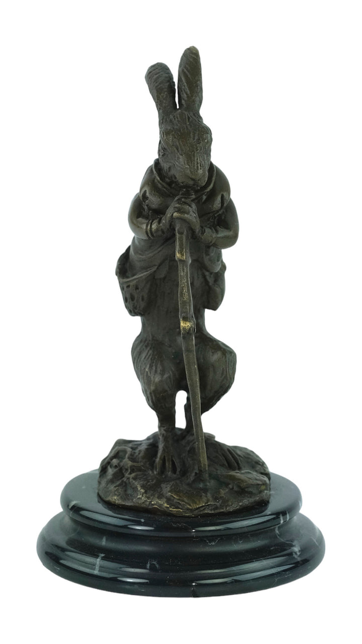 Bronze sculpture of a hare dressed as a hunter