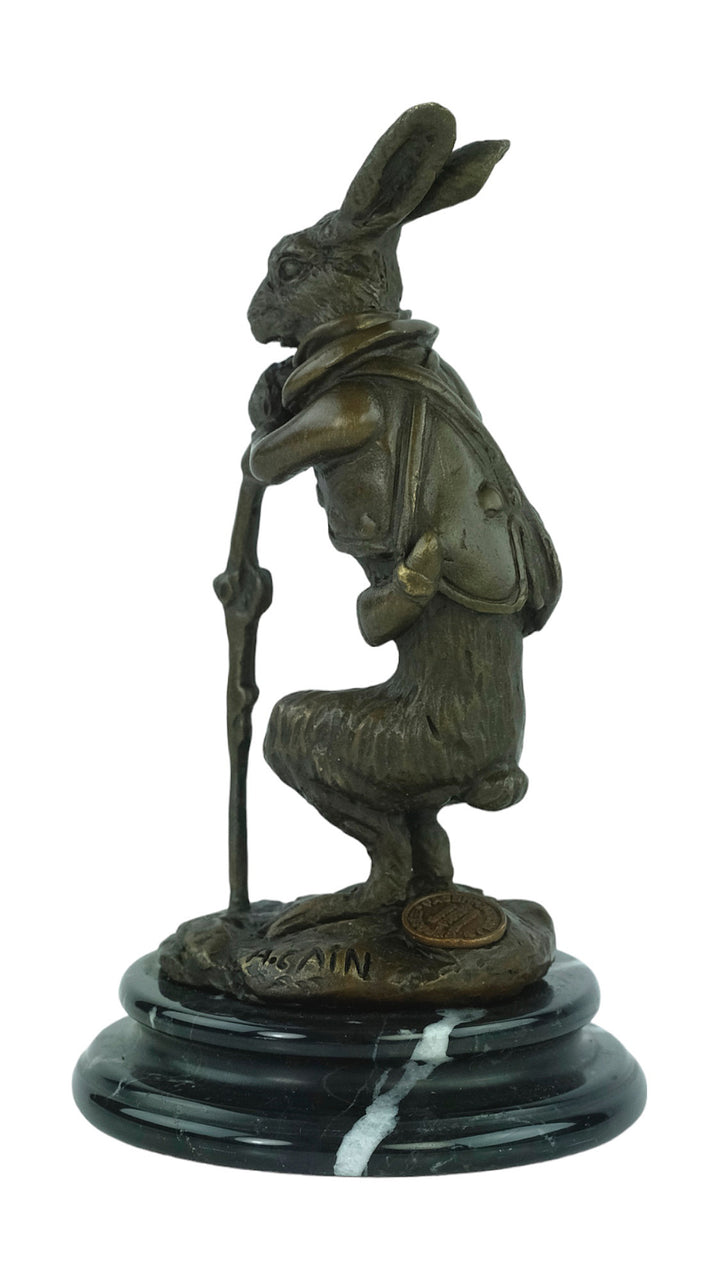 Bronze sculpture of a hare dressed as a hunter