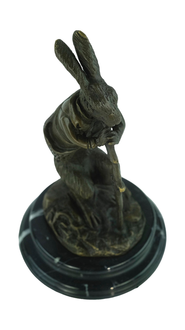 Bronze sculpture of a hare dressed as a hunter