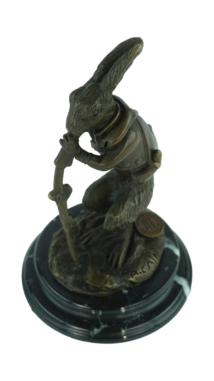 Bronze sculpture of a hare dressed as a hunter