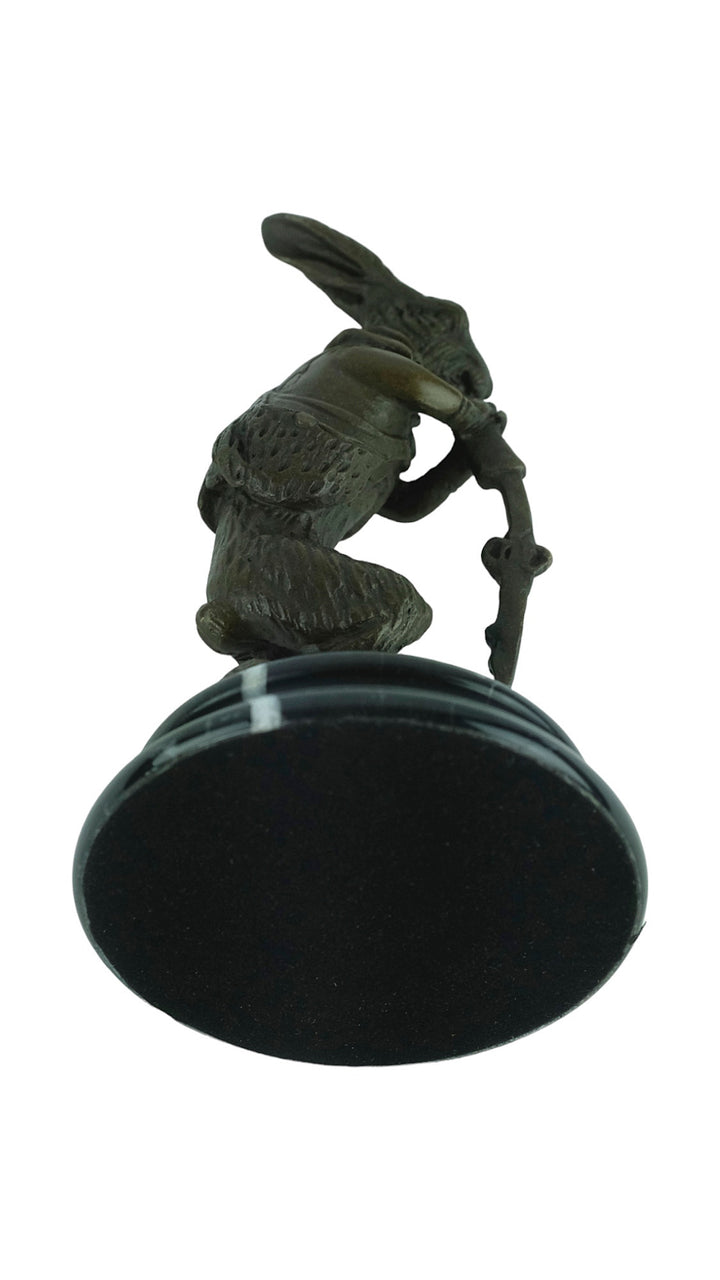 Bronze sculpture of a hare dressed as a hunter