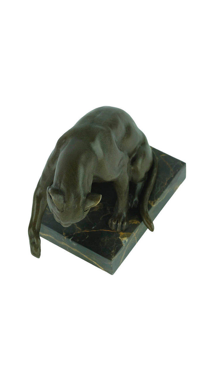 Bronze sculpture of a playing cat