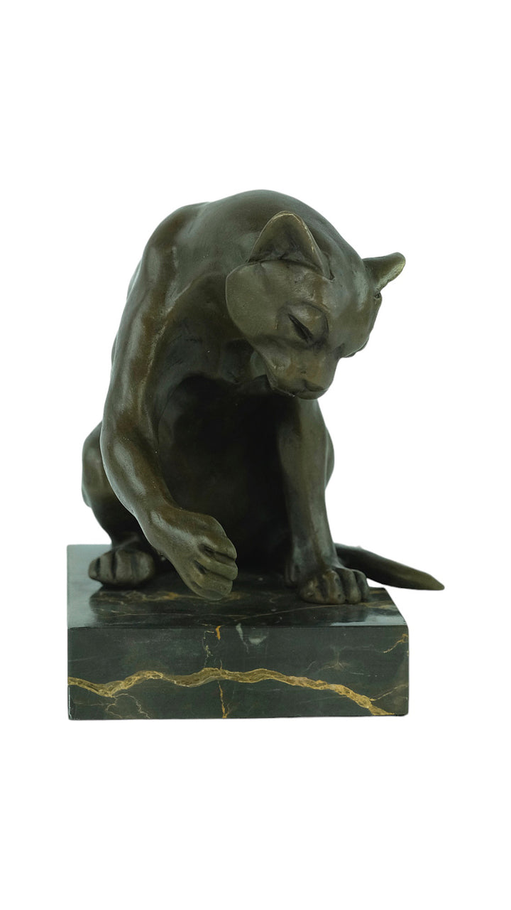 Bronze sculpture of a playing cat